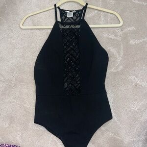 LIGHTLY WORN!!! Black bodysuit w/ lace down middle